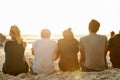 Now thats a view they cant get enough of. Rearview shot of a group of unidentifiable friends admiring the sunset Royalty Free Stock Photo