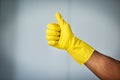 Now that was great cleaning. a man wearing a rubber cleaning glove inside.