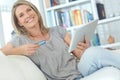 Now this is what I call comfortable shopping. Portrait of an attractive mature woman doing some online shopping at home. Royalty Free Stock Photo