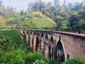 Walk along the rails on the Nine Arch Bridge in Ella