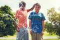 Now you the one getting wet. adorable young boys playing with water balloons outdoors. Royalty Free Stock Photo