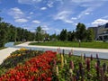 Noyabrsk, Russia - June 20, 2021: Summer square of Geologists against the background of blue sky and clouds