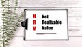 NRV text on clipboard with plant on wooden background Royalty Free Stock Photo