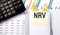 NRV text, written on a sticker with calculator,pen on chart background Royalty Free Stock Photo