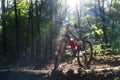 Sports bike in the spring forest in the rays of sunlight