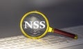 NSS - Network Security Services text on magnifier on a keyboard, business concept