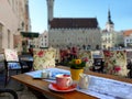 Street Cafe, tables and chairs in the city are waiting for people to rest and have a cup of coffee in Europe. Baltic Old Town of Royalty Free Stock Photo