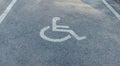 nternational markings for a handicapped parking. Disabled symbol sign on asphalt in parking space. I