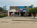 Typical roadside market village buildings, selling clothing and banking services