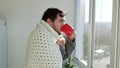 Nuanced Scene Young Man in Blanket Confronts Flu at Home