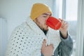 Nuanced Scene Young Man in Blanket Confronts Flu at Home