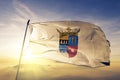 Nuble Region of Chile flag textile cloth fabric waving on the top sunrise mist fog