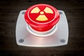 Nuclear button, radiation push-button on the wooden table, 3D r Royalty Free Stock Photo