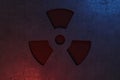 Nuclear energy radioactive ionizing atomic radiation round symbol shape painted on massive metal wall texture dark background.