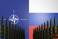 Nuclear missiles standing in row with NATO and Russia flags on background. Cold war concept. Russian-ukrainian conflict