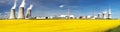 Nuclear power plant with field of rapeseed Royalty Free Stock Photo