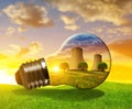 Nuclear power plant in light bulb. Royalty Free Stock Photo