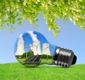 Nuclear power plant with solar panel and wind turbines in lightbulb. Royalty Free Stock Photo