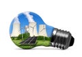 Nuclear power plant with solar panel and wind turbines in lightbulb Royalty Free Stock Photo
