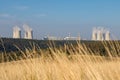 Nuclear power plant in summer landscape under blue sky Royalty Free Stock Photo