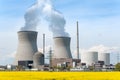 Nuclear power plant with yellow field Royalty Free Stock Photo