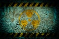 Nuclear radiation warning symbol on grunge wall background Royalty Free Stock Photo