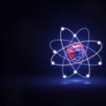 Nucleus features red and blue spheres representing protons and Royalty Free Stock Photo