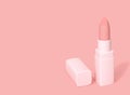Nude color, pink matte lipstick on pink background
