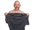 Nude man holding a t-shirt on white background Royalty Free Stock Photo