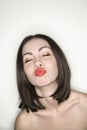 Nude woman puckering lips. Royalty Free Stock Photo