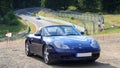 Blue roadster Porsche Boxster 986 at race track Nordschleife