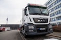 MAN flatbed truck stands on roadside