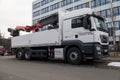 MAN flatbed truck stands on roadside