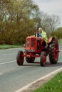 Ely, Cambridgeshire-UK: April 2023: Nuffield orange tractor driving on main road.