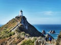 Nugget Point lighthouse in Otago region of the South Island of New Zealand in the afternoon Royalty Free Stock Photo