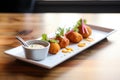 nuggets served as a appetizer on small plates