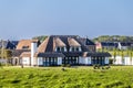 Example of Modern white villa with straw roofing