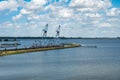 Numansdorp, South Holland, The Netherlands - Industrial cranes and docks at the Hollandsch Diep river Royalty Free Stock Photo