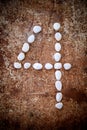 '4' number alphabet made form white stone
