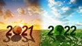 Number 2021 with arid planet and 2022 with lush planet. Concept of Happy New Year.