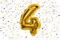The number of the balloon made of golden foil, the number four on a white background with multicolored sequins. Royalty Free Stock Photo