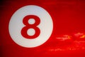 Door of a red car with number 8 drawn on it