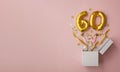 Number 60 birthday balloon celebration gift box lay flat explosion Royalty Free Stock Photo