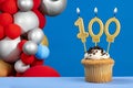 Number 100 birthday candle - Anniversary card with balloons Royalty Free Stock Photo