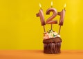 Number 121 birthday candle - Celebration on yellow background