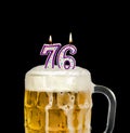 Number 76 candle in beer