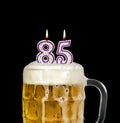 Number 85 candle in beer