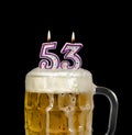 Number 53 candle in beer mug