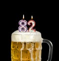 Number 82 candle in beer