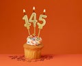 Number 145 candle - Birthday card design in orange background